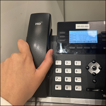 The desk phone with the receiver in place